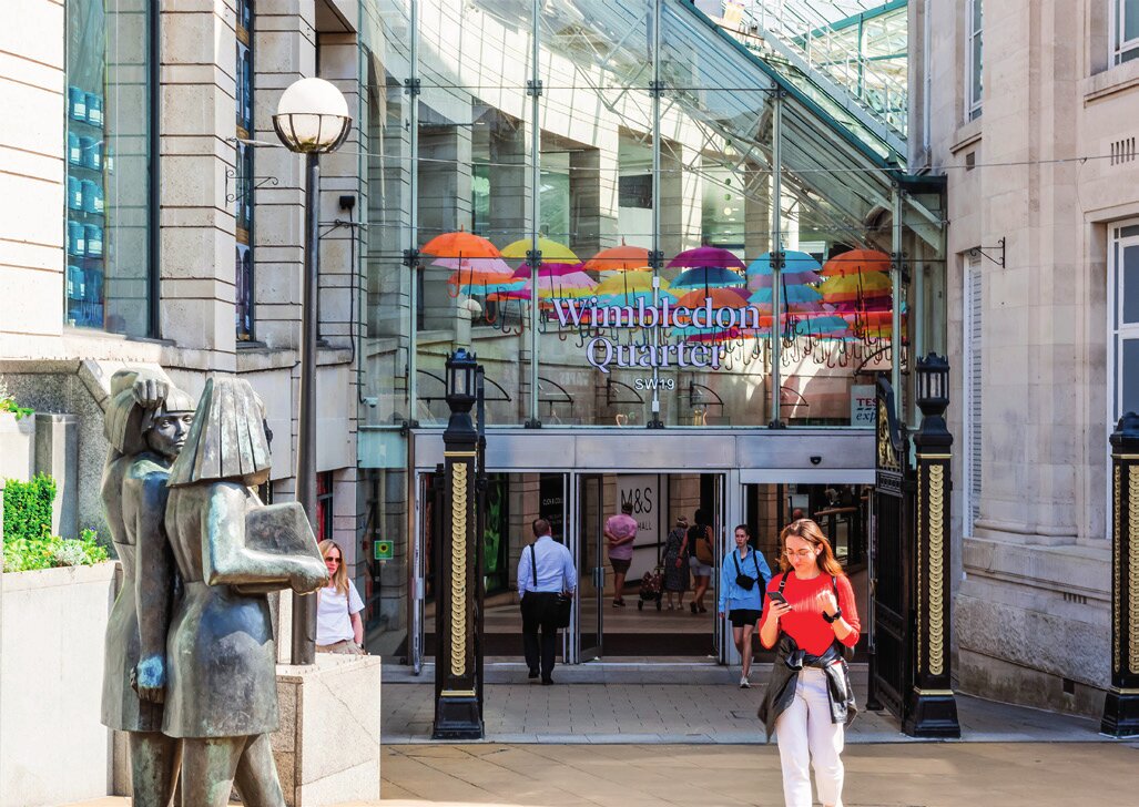 Entrance to Wimbledon station beside the town-centre sculpture